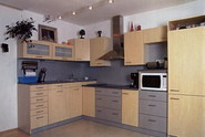 Kuchyň je přesně v duchu filozofie celého bytu - hodně světla, vzduchu a prostoru.